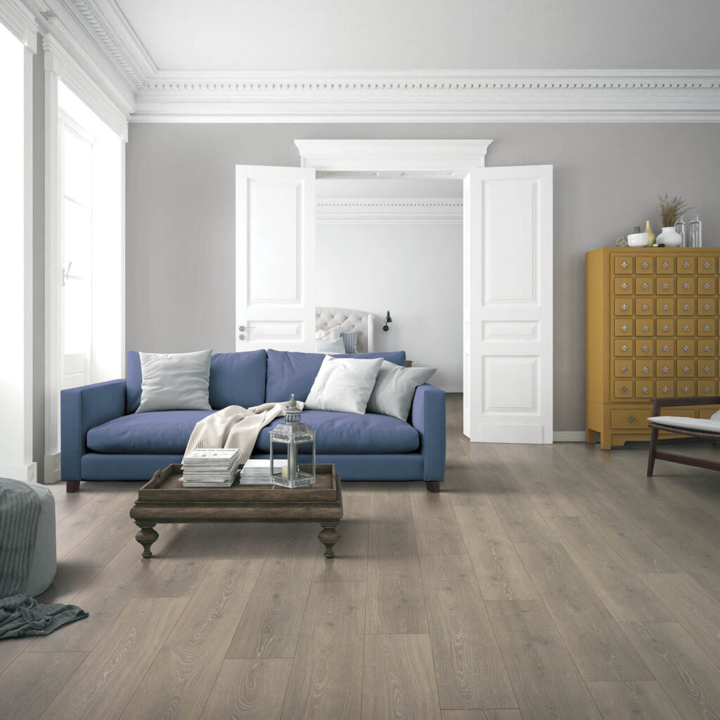 Dark gray laminate flooring in living room with blue sofa