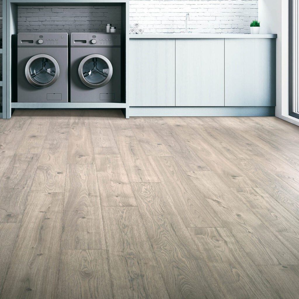 Medium brown laminate flooring in laundry room