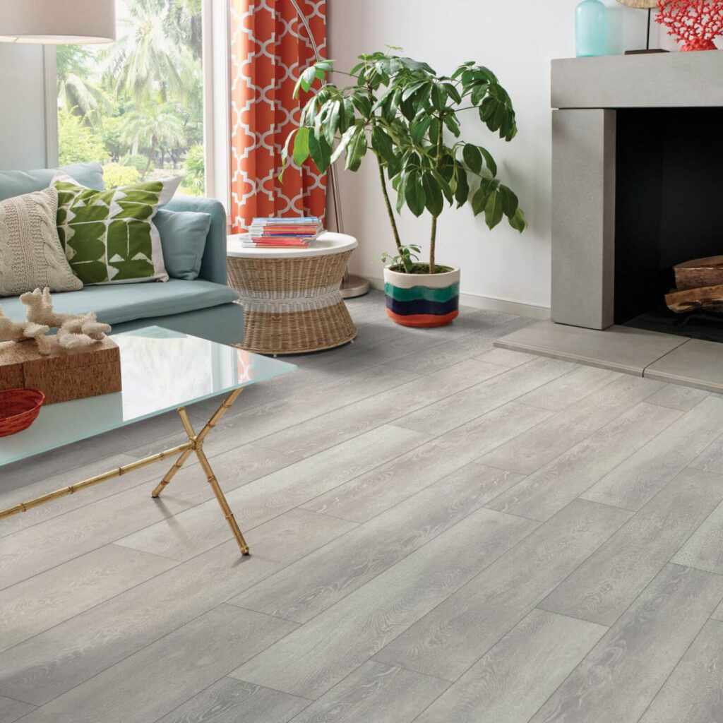 Cozy sitting area with light gray vinyl flooring near fireplace