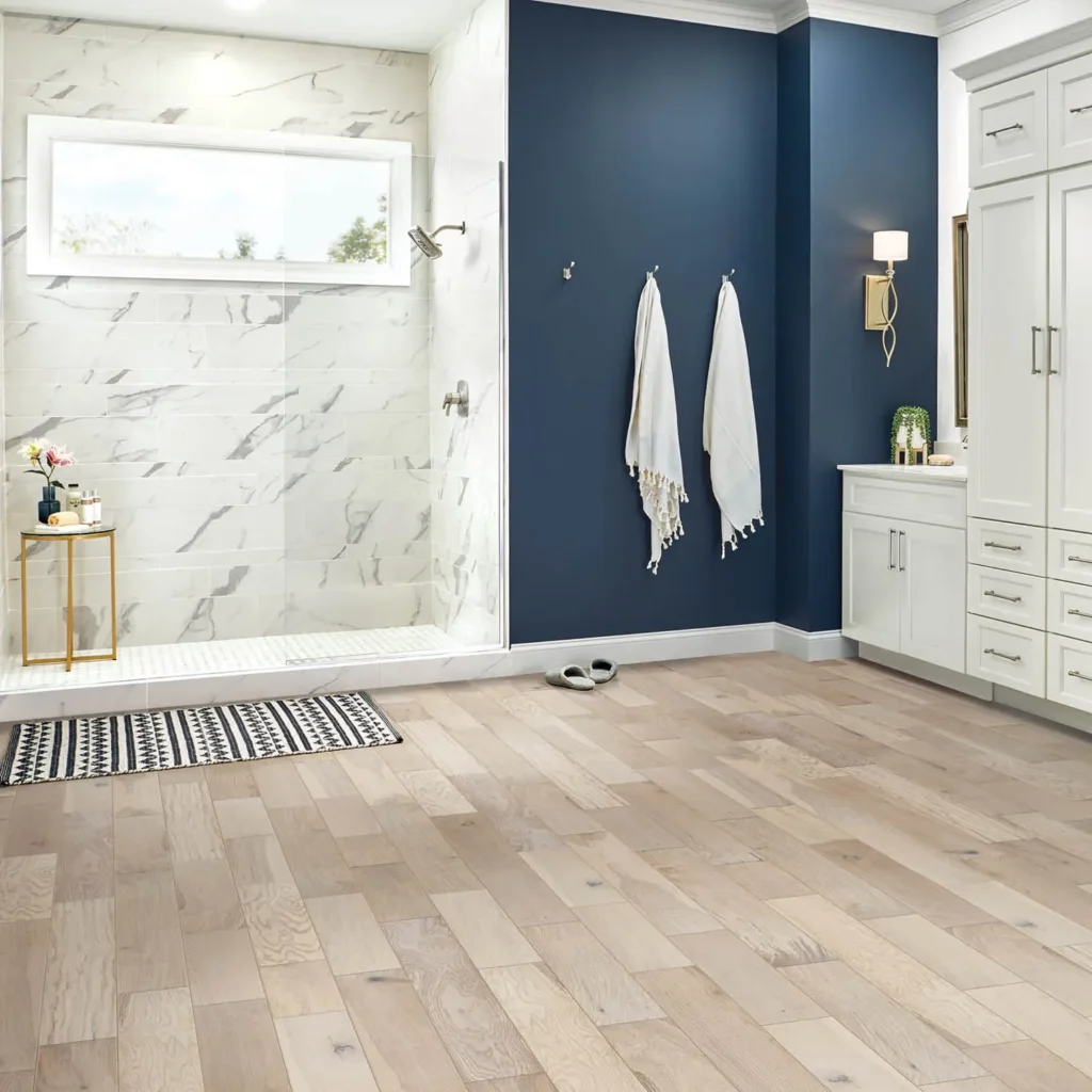 Beige wood-look tile flooring in bathroom with blue accent wall